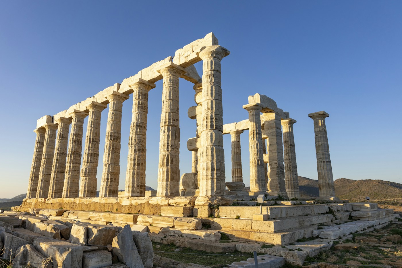 Ancient columns of the Temple of Poseidon looking out over Cape Sounion